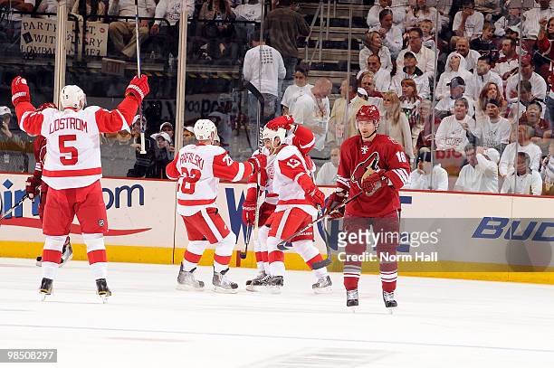 Nicklas Lidstrom, Brian Rafalski and Pavel Datsyuk of the Detroit Red Wings celebrate a second period goal against the Phoenix Coyotes in Game Two of...