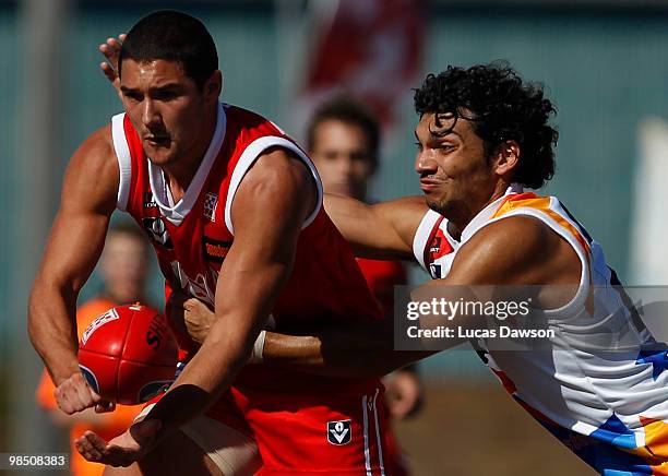 Shaun Grigg of Northern Bullants handballs the ball during the round two VFL match between North Ballarat and Northern Bullants at Eureka Stadium on...