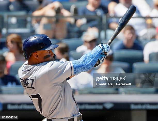 Carlos Gomez of the Tampa Bay Rays hits a double in an MLB baseball game against the New York Yankees on June 17, 2018 at Yankee Stadium in the Bronx...