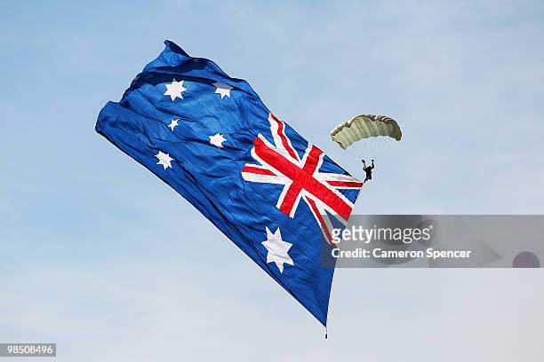 Sky diver flying the Australian Flag enters the course prior to the Red Bull Air Race Qualifying on April 17, 2010 in Perth, Australia.