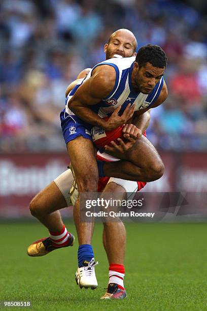 Daniel Wells of the Kangaroos marks infront of Jarrad McVeigh of the Swans during the round four AFL match between the North Melbourne Kangaroos and...