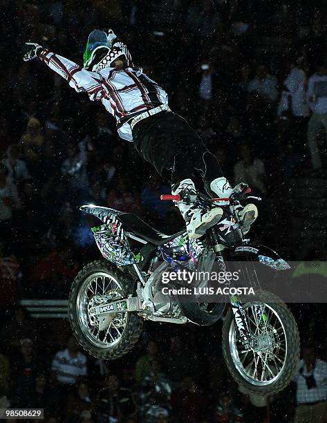 Japanese motorcyclist Eigo Sato performs during the freestyle motocross show first round of the World tour 'Red Bull X Fighters' at the Bull ring in...