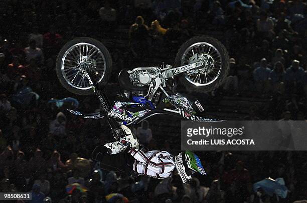 Japanese motorcyclist Eigo Sato performs during the freestyle motocross show first round of the World tour 'Red Bull X Fighters' at the Bull ring in...