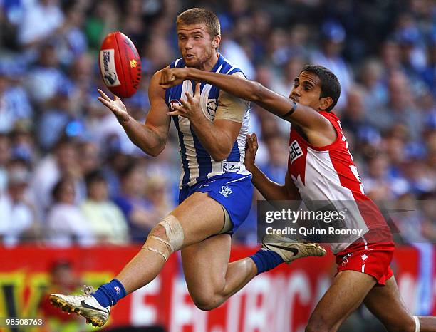 Leigh Adams of the Kangaroos marks infront of Lewis Jetta of the Swans during the round four AFL match between the North Melbourne Kangaroos and the...