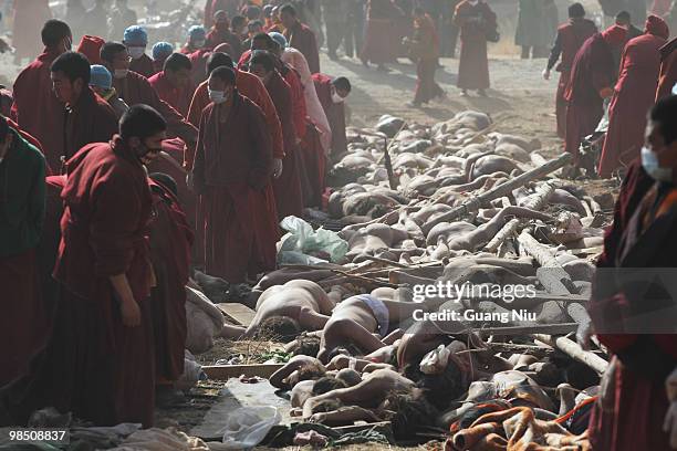 Tibetan monks prepare a mass cremation for the victims of a strong earthquake, on April 17 in Jiegu, near Golmud, China. Current reports state 1144...