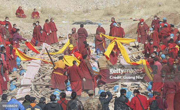 Tibetan monks prepare a mass cremation for the victims of a strong earthquake, on April 17 in Jiegu, near Golmud, China. Current reports state 1144...