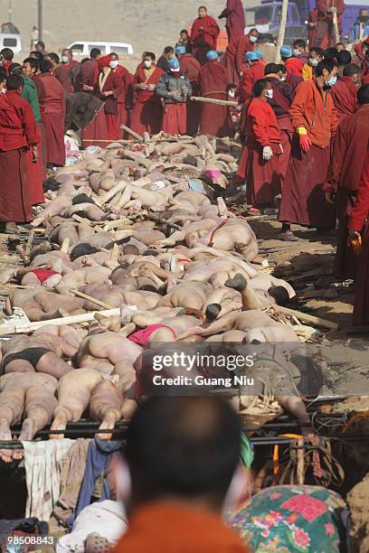 Tibetan monks prepare a mass cremation for the victims of a strong earthquake, on April 17 in Jiegu, near Golmud, China. Current reports state 1144...