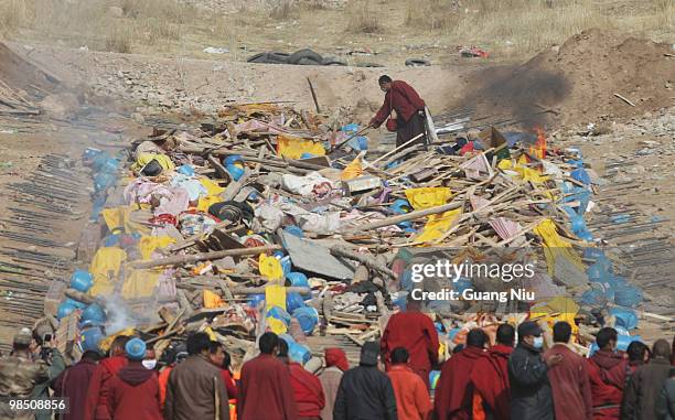 Tibetan monks prepare a mass cremation for the victims of a strong earthquake, on April 17 in Jiegu, near Golmud, China. Current reports state 1144...