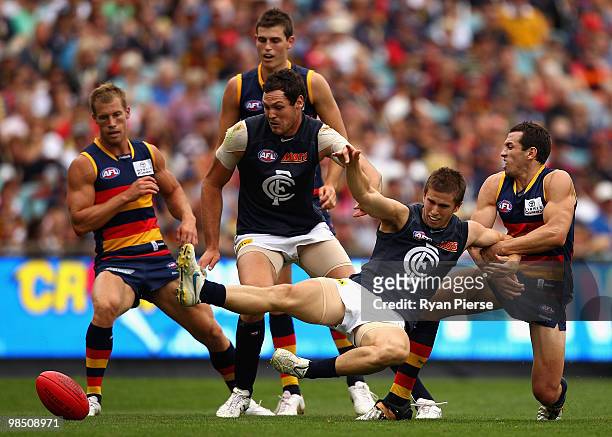 Michael Doughty of the Crows pulls Marc Murphy of the Blues off the ball during the round four AFL match between the Adelaide Crows and the Carlton...