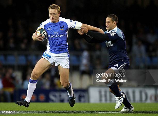 Ryan Cross of the Force is tackled by Luke McAlister of the Blues during the round 10 Super 14 match between the Blues and the Western Force at Eden...