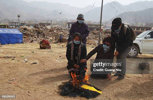 Tibetan monks prepare a mass cremation for the victims of a strong earthquake, on April 17 in Jiegu, near Golmud, China. Current reports state 1144...