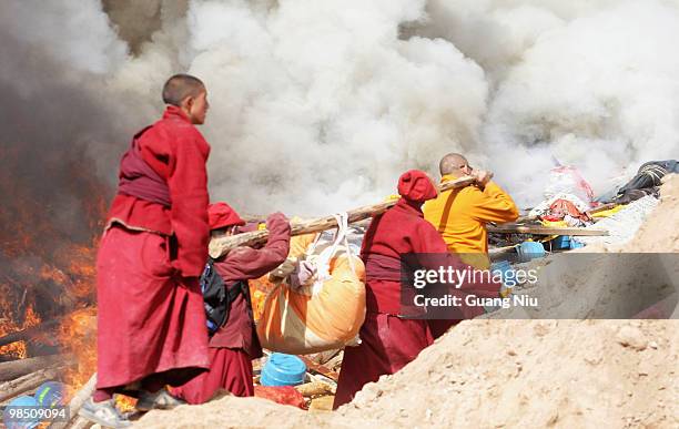 Tibetan monks prepare a mass cremation for the victims of a strong earthquake, on April 17 in Jiegu, near Golmud, China. Current reports state 1144...