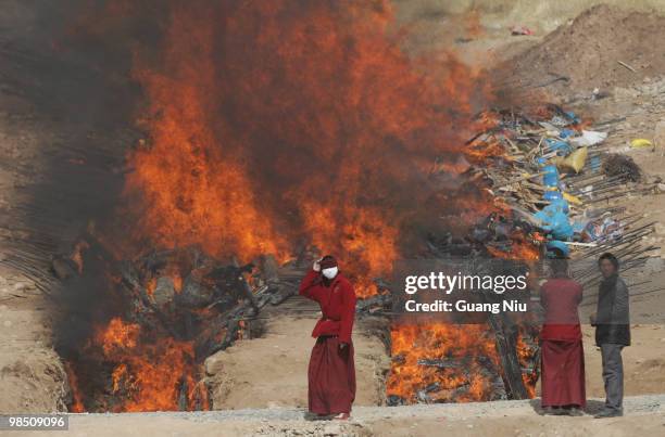 Tibetan monks prepare a mass cremation for the victims of a strong earthquake, on April 17 in Jiegu, near Golmud, China. Current reports state 1144...