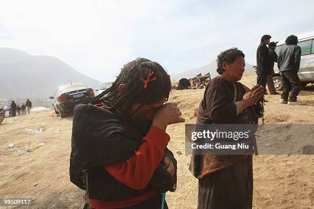 Tibrtan woman cry during a mass cremation for the of a strong earthquake on Jiegu toweship of China's Qinghai province just on April 17, 2010 in...