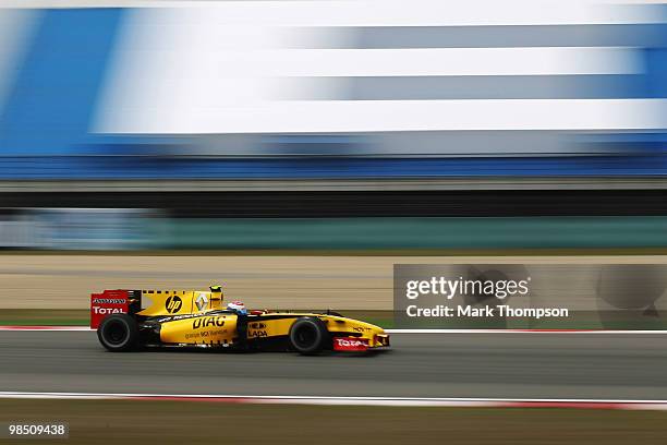 Vitaly Petrov of Russia and Renault drives during the final practice session prior to qualifying for the Chinese Formula One Grand Prix at the...