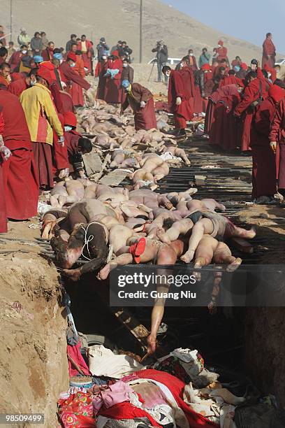 Tibetan monks prepare a mass cremation for the victims of a strong earthquake, on April 17 in Jiegu, near Golmud, China. Current reports state 1144...