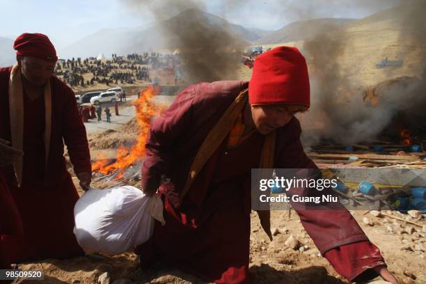 Tibetan monks prepare a mass cremation for the victims of a strong earthquake, on April 17 in Jiegu, near Golmud, China. Current reports state 1144...