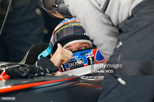 Jenson Button of Great Britain and McLaren Mercedes prepares to drive during practice for the Chinese Formula One Grand Prix at the Shanghai...