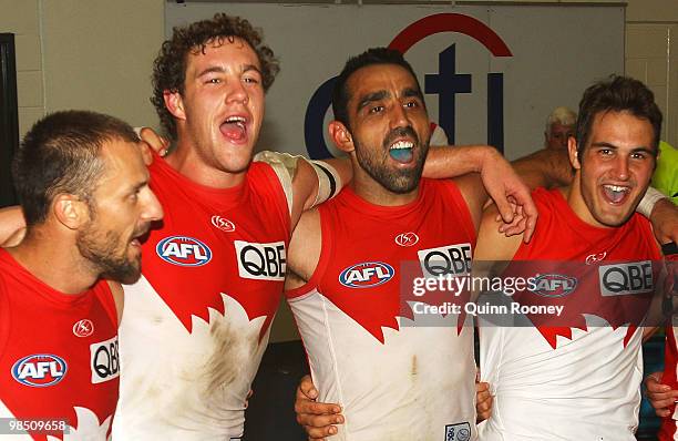 Nick Malceski, Shane Mumford, Adam Goodes and Josh Kennedy of the Swans sing the song in the rooms after winning the round four AFL match between the...