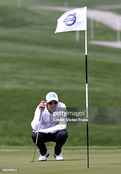 Mikko Ilonen of Finland lines up a put on the 8th green during the Round Three of the Volvo China Open on April 17, 2010 in Suzhou, China.