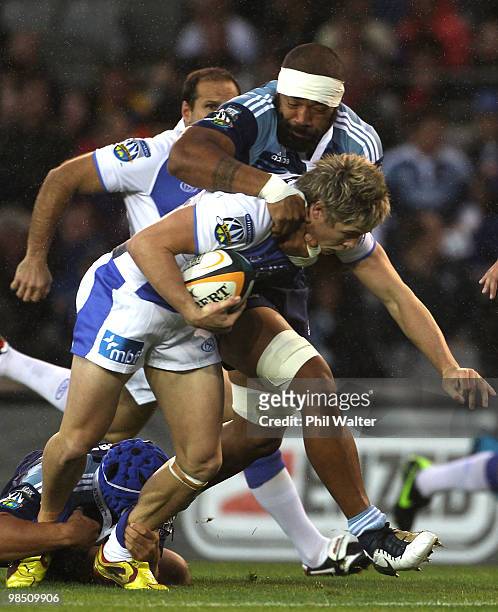James O'Connor of the Force is tackled by Viliami Ma'afu of the Blues during the round 10 Super 14 match between the Blues and the Western Force at...