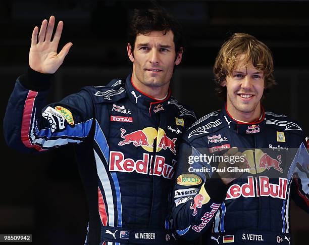 Pole sitter Sebastian Vettel of Germany and Red Bull Racing celebrates in parc ferme alongside second placed Mark Webber of Australia and Red Bull...