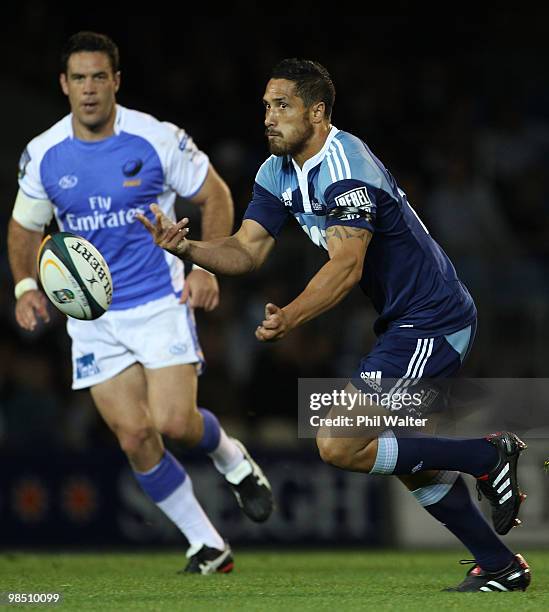 Stephen Brett of the Blues offloads the ball during the round 10 Super 14 match between the Blues and the Western Force at Eden Park on April 17,...