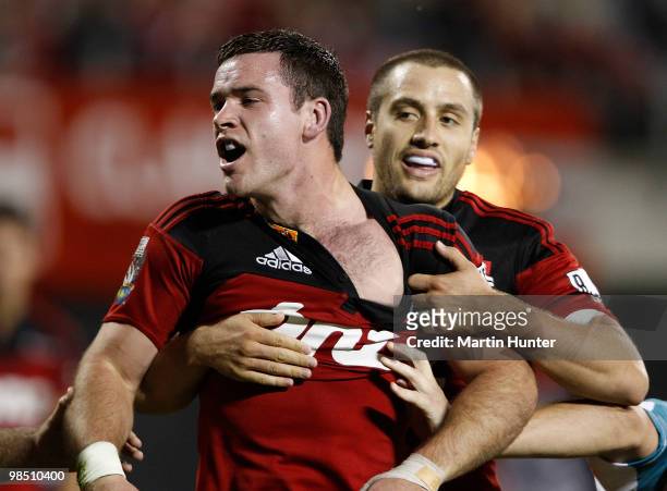 Ryan Crotty of the Crusaders celebrates after scoring a try with team mate Tim Bateman during the round 10 Super 14 match between the Crusaders and...