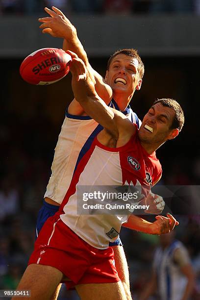 Hamish McIntosh of the Kangaroos and Mark Seaby of the Swans contest in the ruck during the round four AFL match between the North Melbourne...