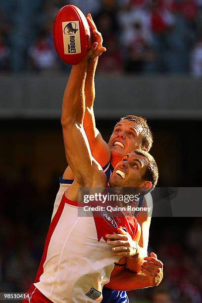 Hamish McIntosh of the Kangaroos and Mark Seaby of the Swans contest in the ruck during the round four AFL match between the North Melbourne...