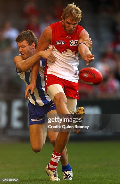 Lewis Roberts-Thomson of the Swans is tackled by Lachlan Hansen of the Kangaroos during the round four AFL match between the North Melbourne...