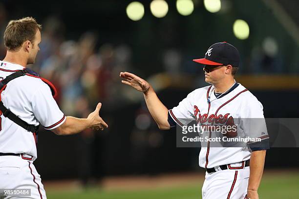 Kris Medlen and David Ross of the Atlanta Braves celebrate after the game against the Colorado Rockies at Turner Field on April 16, 2010 in Atlanta,...