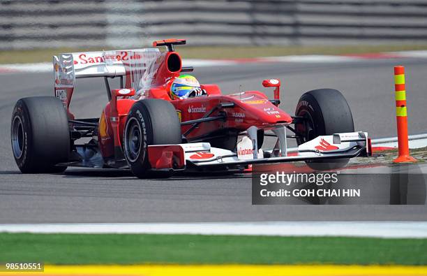 Ferrari driver Fernando Alonso of Spain drives his car during the final qualify session for Formula One's Chinese Grand Prix in Shanghai on April 17,...