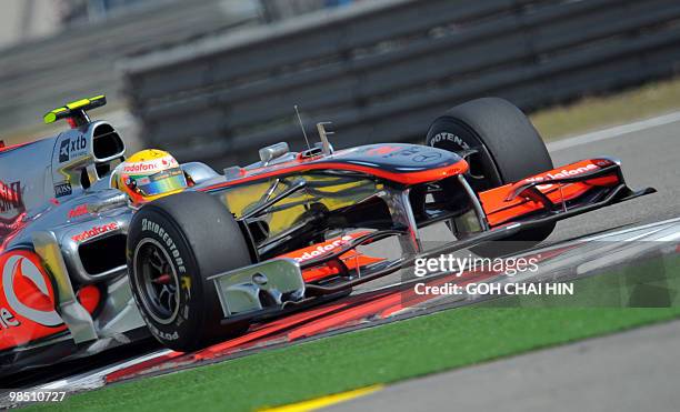 McLaren-Mercedes driver Lewis Hamilton of Britain drives his car during the final qualifying session for Formula One's Chinese Grand Prix in Shanghai...