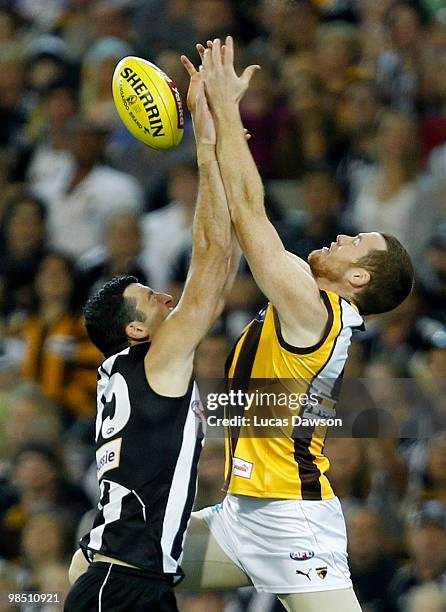 Simon Prestigiacomo of the Magpies attempts a mark against Jarryd Roughead of the Hawks during the round four AFL match between the Collingwood...