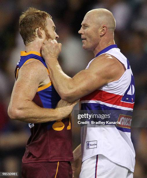 Daniel Merrett of the Lions and Barry Hall of the Bulldogs vent their frustrations during the round four AFL match between the Brisbane Lions and the...