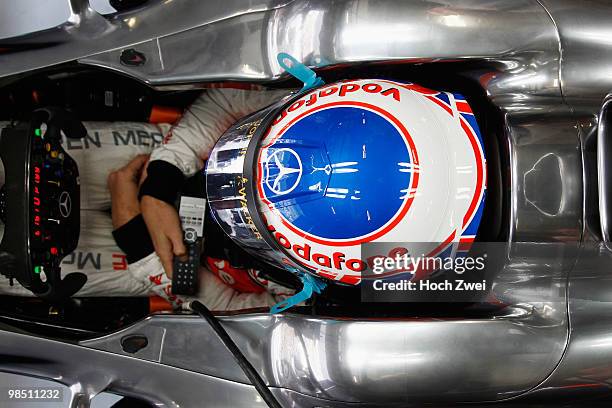 Jenson Button of Great Britain and McLaren Mercedes prepares to drive during qualifying for the Chinese Formula One Grand Prix at the Shanghai...