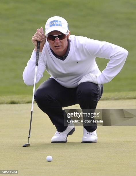 Mikko Ilonen of Finland lines up a put on the 16th green during the Round Three of the Volvo China Open on April 17, 2010 in Suzhou, China.