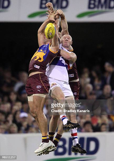 Jared Brennan of the Lions and Barry Hall of the Bulldogs compete for the ball during the round four AFL match between the Brisbane Lions and the...