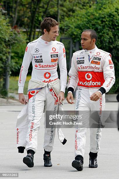 Lewis Hamilton of Great Britain and McLaren Mercedes and Jenson Button of Great Britain and McLaren Mercedes prepare to drive during qualifying for...