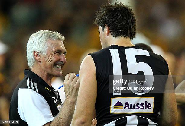 Mick Malthouse the coach of the Magpies talks to Leigh Brown during the round four AFL match between the Collingwood Magpies and the Hawthorn Hawks...