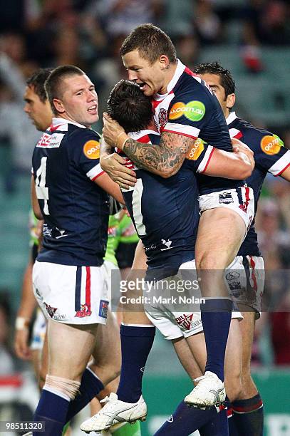Todd Carney of the Roosters celebrate a try by Shaun Kenny-Dowall with Mitchell Pearce during the round six NRL match between the Sydney Roosters and...