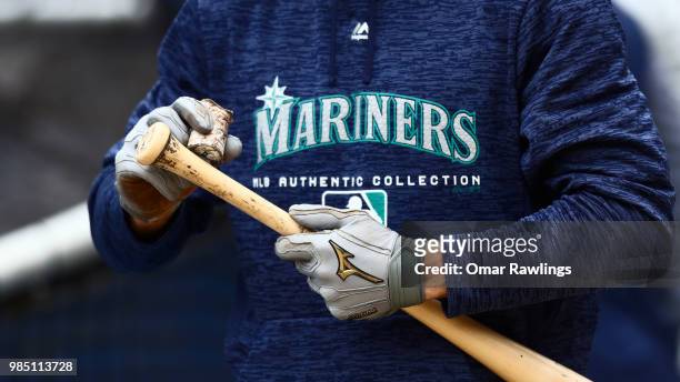 Andrew Romine of the Seattle Mariners applies pine tar to his bat before the game against the Boston Red Sox at Fenway Park on June 23, 2018 in...