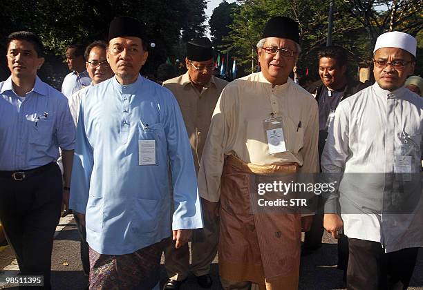 Malaysian opposition leader Anwar Ibrahim and Zaid Ibrahim , candidate for Parti Keadilan Rakyat , arrive for the nomination process for the Hulu...