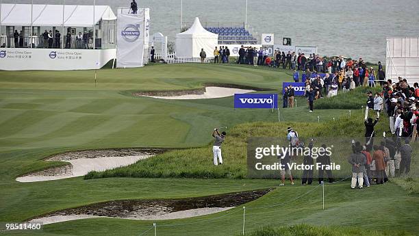 Thongchai Jaidee of Thailand plays his approach shot on the 18th hole during the Round Three of the Volvo China Open on April 17, 2010 in Suzhou,...