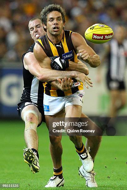 Chance Bateman of the Hawks is tackled by Nick Maxwell of the Magpies during the round four AFL match between the Collingwood Magpies and the...