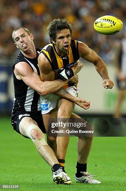 Chance Bateman of the Hawks is tackled by Nick Maxwell of the Magpies during the round four AFL match between the Collingwood Magpies and the...