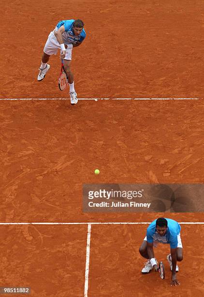 Mahesh Bhupathi of India and Max Mirnyi of Belarus in action in the doubles match against Simon Aspelin of Sweden and Paul Hanley of Australia during...