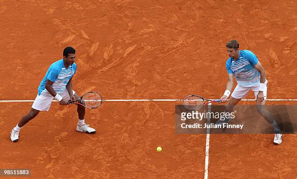 Mahesh Bhupathi of India and Max Mirnyi of Belarus in action in the doubles match against Simon Aspelin of Sweden and Paul Hanley of Australia during...