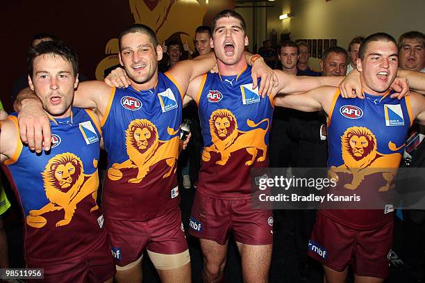 Brendan Fevola and Jonathan Brown of the Lions celebrate victory with team mates after the round four AFL match between the Brisbane Lions and the...